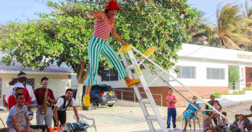 Clowns Without Borders artist Carolina “CoiCoi” balances on a ladder during a Colombia coastal tour, 2018.