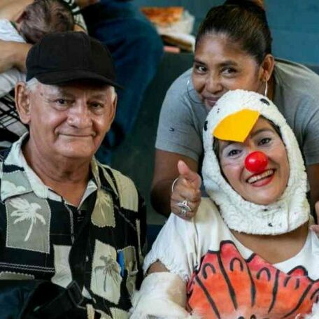 The image shows clown with audult audience members