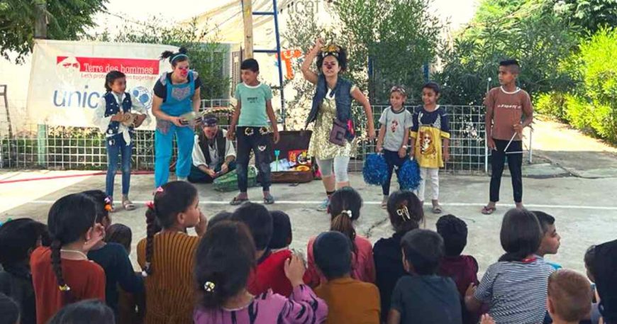 Clowns welcome children to the stage during a show for people who are stateless in Iraqi Kurdistan