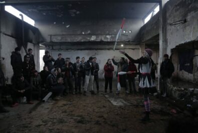 Clown performing in a group while in bunker