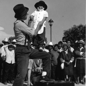 Andres holds up a toddler boy at a late 1980s performance in Chiapas. Celebrating our 100th project