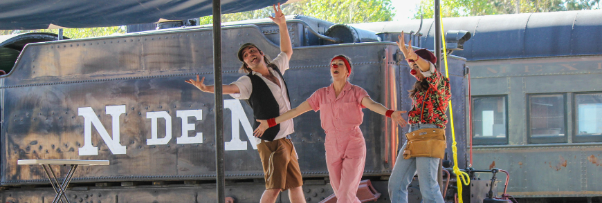 Three clowns in Mexicio perform in front of La Bestia train